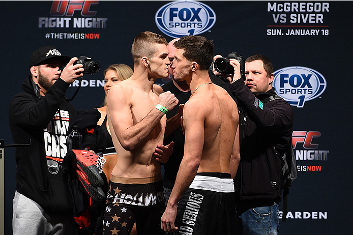 BOSTON, MA - JANUARY 17:  Johnny Case (L) and Frankie Perez face off during the UFC Fight Night Boston weigh-in event at the Orpheum Theatre on January 17, 2015 in Boston, Massachusetts. (Photo by Jeff Bottari/Zuffa LLC/Zuffa LLC via Getty Images)