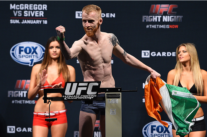 BOSTON, MA - JANUARY 17: Paddy Holohan of Ireland interacts with the crowd holding an Irish flag during the UFC Fight Night Boston weigh-in event at the Orpheum Theatre on January 17, 2015 in Boston, Massachusetts. (Photo by Jeff Bottari/Zuffa LLC/Zuffa