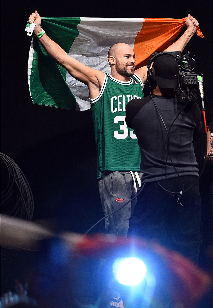 BOSTON, MA - JANUARY 17:  Cathal Pendred of Ireland walks on stage holding an Irish flag during the UFC Fight Night Boston weigh-in event at the Orpheum Theatre on January 17, 2015 in Boston, Massachusetts. (Photo by Jeff Bottari/Zuffa LLC/Zuffa LLC via G