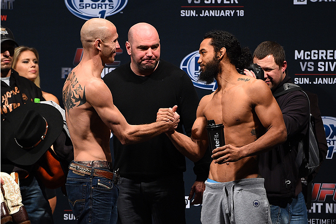 BOSTON, MA - JANUARY 17:  UFC lightweights Donald 'Cowboy' Cerrone (L) and Benson 'Smooth' Henderson face off during the UFC Fight Night Boston weigh-in event at the Orpheum Theatre on January 17, 2015 in Boston, Massachusetts. (Photo by Jeff Bottari/Zuff