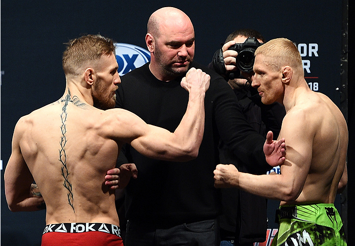 BOSTON, MA - JANUARY 17:  UFC featherweights Conor 'The Notorious' McGregor of Ireland (L) faces off with opponent Dennis Siver of Germany during the UFC Fight Night Boston weigh-in event at the Orpheum Theatre on January 17, 2015 in Boston, Massachusetts