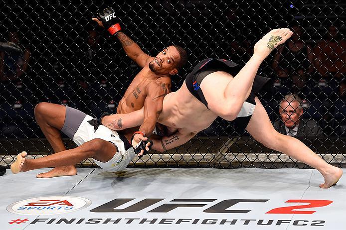 BRISBANE, AUSTRALIA - MARCH 20:   (R-L) Damien Brown of Australia takes down Alan Patrick of Brazil in their lightweight bout during the UFC Fight Night event at the Brisbane Entertainment Centre on March 20, 2016 in Brisbane, Australia. (Photo by Josh He