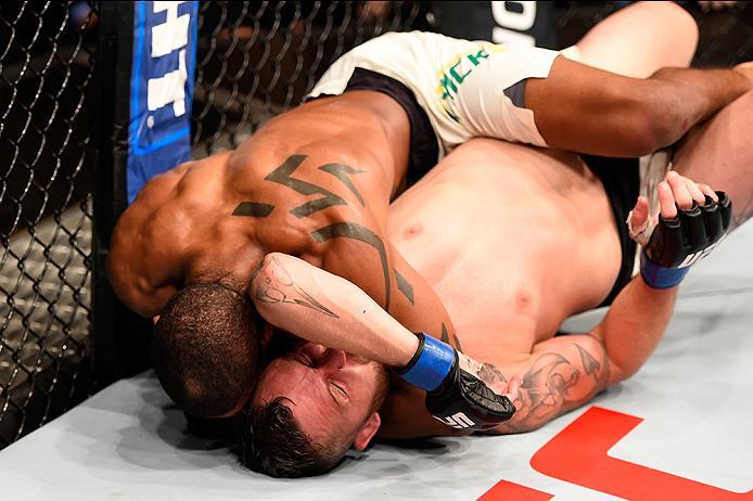 BRISBANE, AUSTRALIA - MARCH 20: (L-R) Alan Patrick of Brazil attempts a submission against Damien Brown of Australia in their lightweight bout during the UFC Fight Night event at the Brisbane Entertainment Centre on March 20, 2016 in Brisbane, Australia
