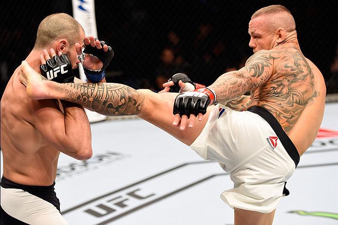 BRISBANE, AUSTRALIA - MARCH 20:   (R-L) Ross Pearson of England kicks Chad Laprise of Canada in their lightweight bout during the UFC Fight Night event at the Brisbane Entertainment Centre on March 20, 2016 in Brisbane, Australia. (Photo by Josh Hedges/Zu