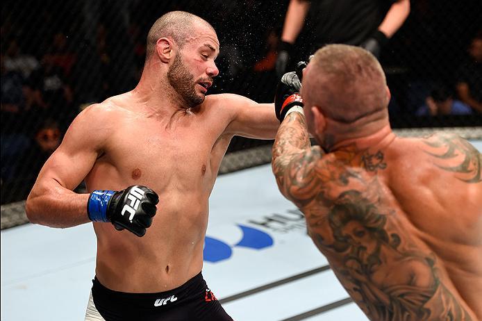 BRISBANE, AUSTRALIA - MARCH 20:   (R-L) Ross Pearson of England punches Chad Laprise of Canada in their lightweight bout during the UFC Fight Night event at the Brisbane Entertainment Centre on March 20, 2016 in Brisbane, Australia. (Photo by Josh Hedges/