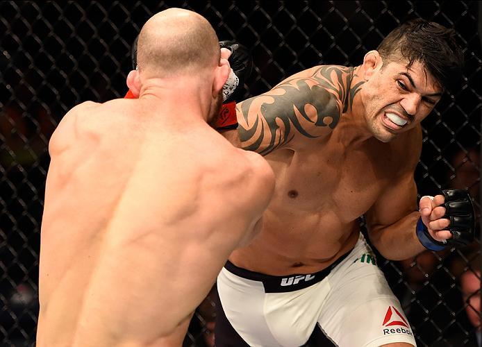 BRISBANE, AUSTRALIA - MARCH 20:   (R-L) Viscardi Andrade of Brazil punches Rich Walsh of Australia in their welterweight bout during the UFC Fight Night event at the Brisbane Entertainment Centre on March 20, 2016 in Brisbane, Australia. (Photo by Josh He