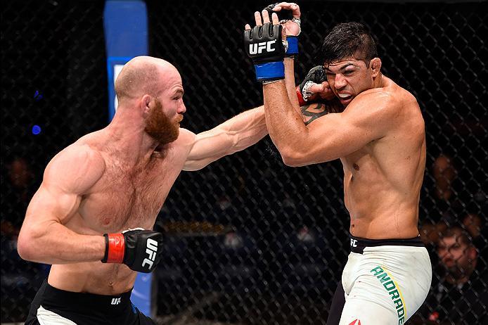 BRISBANE, AUSTRALIA - MARCH 20:   (L-R) Rich Walsh of Australia punches Viscardi Andrade of Brazil in their welterweight bout during the UFC Fight Night event at the Brisbane Entertainment Centre on March 20, 2016 in Brisbane, Australia. (Photo by Josh He