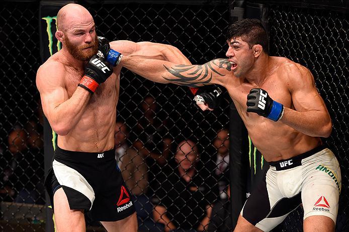 BRISBANE, AUSTRALIA - MARCH 20: (R-L) Viscardi Andrade of Brazil punches Rich Walsh of Australia in their welterweight bout during the UFC Fight Night event at the Brisbane Entertainment Centre on March 20, 2016 in Brisbane, Australia. (Photo by Josh He