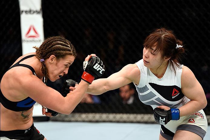 BRISBANE, AUSTRALIA - MARCH 20:   (R-L) Rin Nakai of Japan punches Leslie Smith of the United States in their women's bantamweight bout during the UFC Fight Night event at the Brisbane Entertainment Centre on March 20, 2016 in Brisbane, Australia. (Photo 