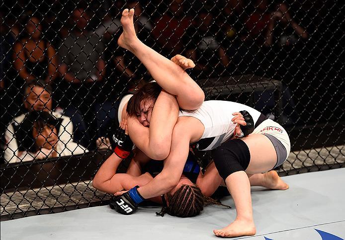 BRISBANE, AUSTRALIA - MARCH 20:  (L-R) Leslie Smith of the United States attempts a submission against Rin Nakai of Japan in their women's bantamweight bout during the UFC Fight Night event at the Brisbane Entertainment Centre on March 20, 2016 in Brisban