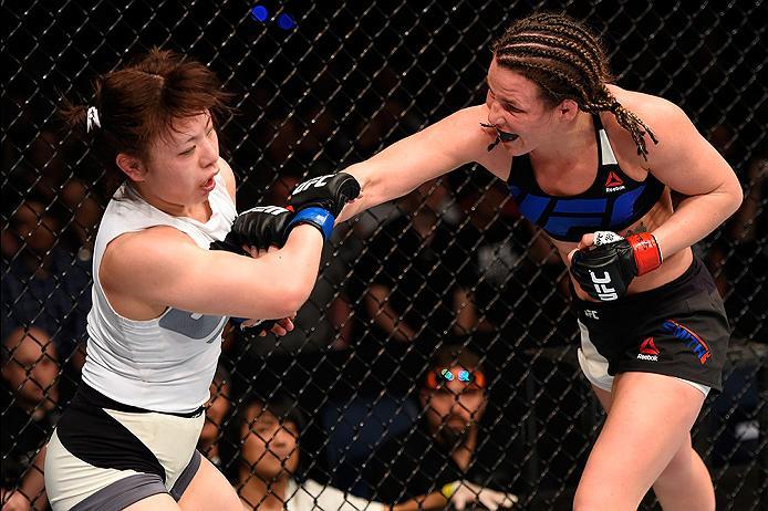 BRISBANE, AUSTRALIA - MARCH 20:  (R-L) Leslie Smith of the United States punches Rin Nakai of Japan in their women's bantamweight bout during the UFC Fight Night event at the Brisbane Entertainment Centre on March 20, 2016 in Brisbane, Australia. (Photo b