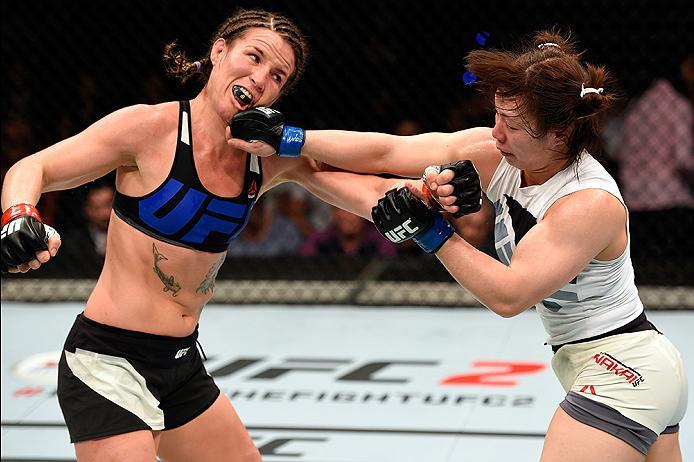 BRISBANE, AUSTRALIA - MARCH 20:  (R-L) Rin Nakai of Japan punches Leslie Smith of the United States in their women's bantamweight bout during the UFC Fight Night event at the Brisbane Entertainment Centre on March 20, 2016 in Brisbane, Australia. (Photo b