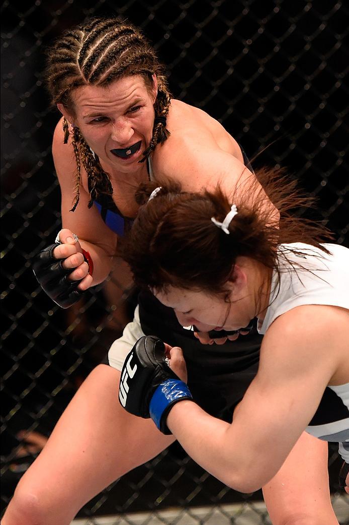 BRISBANE, AUSTRALIA - MARCH 20:  (L-R) Leslie Smith of the United States punches Rin Nakai of Japan in their women's bantamweight bout during the UFC Fight Night event at the Brisbane Entertainment Centre on March 20, 2016 in Brisbane, Australia. (Photo b