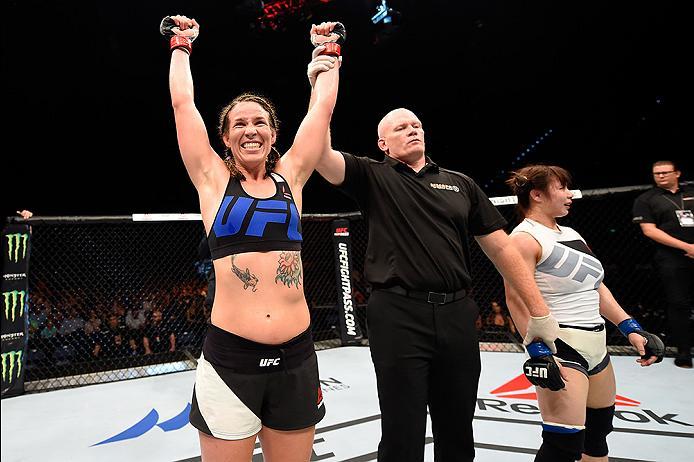 BRISBANE, AUSTRALIA - MARCH 20: (L-R) Leslie Smith of the United States celebrates after defeating Rin Nakai of Japan after their women's bantamweight bout during the UFC Fight Night event at the Brisbane Entertainment Centre on March 20, 2016 in Brisba