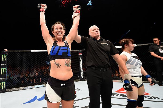 BRISBANE, AUSTRALIA - MARCH 20:   (L-R) Leslie Smith of the United States celebrates after defeating Rin Nakai of Japan after their women's bantamweight bout during the UFC Fight Night event at the Brisbane Entertainment Centre on March 20, 2016 in Brisba