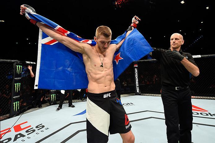 BRISBANE, AUSTRALIA - MARCH 20: Dan Hooker of New Zealand celebrates after defeating Mark Eddiva of the Philippines by guillotine choke in their featherweight bout during the UFC Fight Night event at the Brisbane Entertainment Centre on March 20, 2016 in
