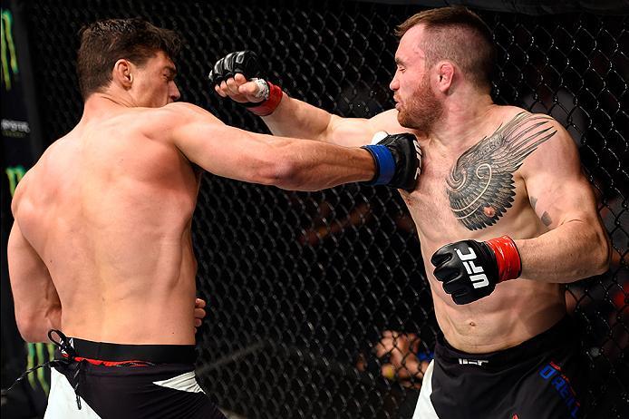 BRISBANE, AUSTRALIA - MARCH 20:  (L-R) Alan Jouban of the United States punches Brendan O'Reilly of Australia in their welterweight bout during the UFC Fight Night event at the Brisbane Entertainment Centre on March 20, 2016 in Brisbane, Australia. (Photo