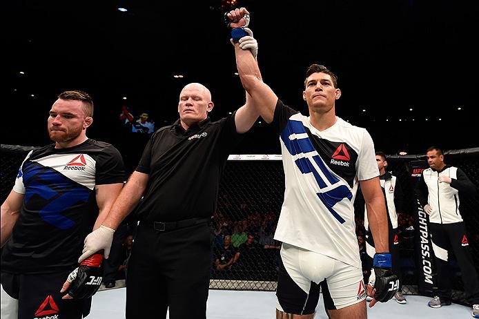 BRISBANE, AUSTRALIA - MARCH 20: (R-L) Alan Jouban of the United States celebrates after defeating Brendan O'Reilly of Australia by TKO in their welterweight bout during the UFC Fight Night event at the Brisbane Entertainment Centre on March 20, 2016 in B