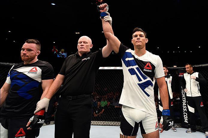 BRISBANE, AUSTRALIA - MARCH 20:  (R-L) Alan Jouban of the United States celebrates after defeating Brendan O'Reilly of Australia by TKO in their welterweight bout during the UFC Fight Night event at the Brisbane Entertainment Centre on March 20, 2016 in B