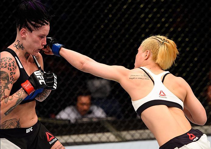 BRISBANE, AUSTRALIA - MARCH 20:  (R-L) Seohee Ham of South Korea punches Bec Rawlings of Australia in their women's strawweight bout during the UFC Fight Night event at the Brisbane Entertainment Centre on March 20, 2016 in Brisbane, Australia. (Photo by 