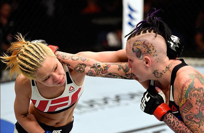 BRISBANE, AUSTRALIA - MARCH 20: (L-R) Seohee Ham of South Korea and Bec Rawlings of Australia exchange punches in their women's strawweight bout during the UFC Fight Night event at the Brisbane Entertainment Centre on March 20, 2016 in Brisbane, Australi