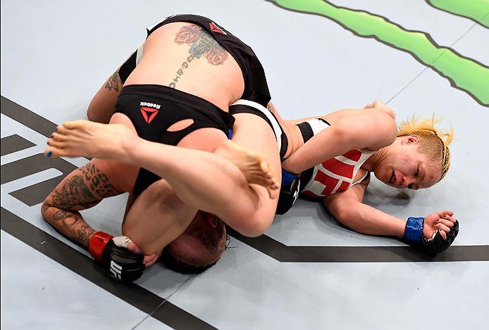 BRISBANE, AUSTRALIA - MARCH 20: (R-L) Seohee Ham of South Korea attempts a submission against Bec Rawlings of Australia in their women's strawweight bout during the UFC Fight Night event at the Brisbane Entertainment Centre on March 20, 2016 in Brisbane,