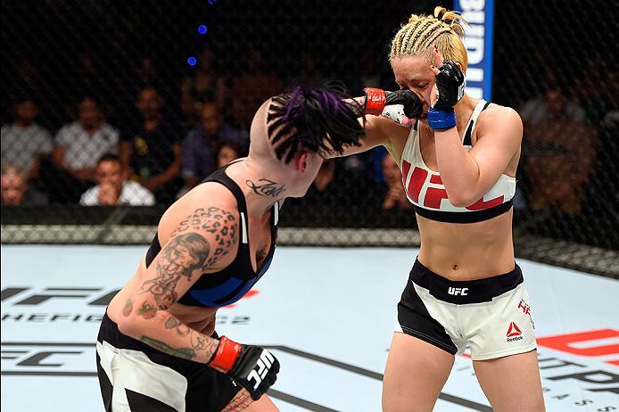 BRISBANE, AUSTRALIA - MARCH 20: (L-R) Bec Rawlings of Australia punches Seohee Ham of South Korea in their women's strawweight bout during the UFC Fight Night event at the Brisbane Entertainment Centre on March 20, 2016 in Brisbane, Australia. (Photo by