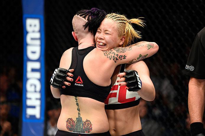 BRISBANE, AUSTRALIA - MARCH 20: (L-R) Bec Rawlings of Australia embraces Seohee Ham of South Korea after their women's strawweight bout during the UFC Fight Night event at the Brisbane Entertainment Centre on March 20, 2016 in Brisbane, Australia. (Photo