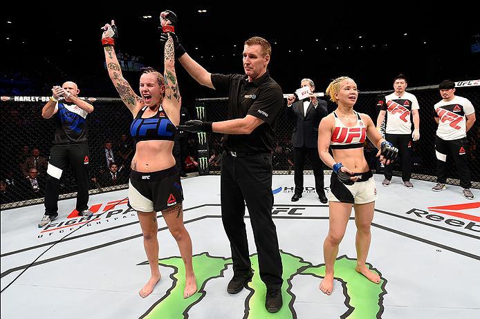 BRISBANE, AUSTRALIA - MARCH 20:  (L-R) Bec Rawlings of Australia celebrates after defeating Seohee Ham of South Korea in their women's strawweight bout during the UFC Fight Night event at the Brisbane Entertainment Centre on March 20, 2016 in Brisbane, Au