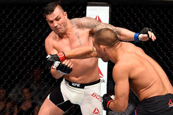 BRISBANE, AUSTRALIA - MARCH 20:  (R-L) James Te Huna of New Zealand punches Steve Bosse of Canada in their light heavyweight bout during the UFC Fight Night event at the Brisbane Entertainment Centre on March 20, 2016 in Brisbane, Australia. (Photo by Jos