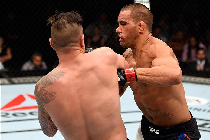 BRISBANE, AUSTRALIA - MARCH 20:  (L-R) Steve Bosse of Canada punches James Te Huna of New Zealand in their light heavyweight bout during the UFC Fight Night event at the Brisbane Entertainment Centre on March 20, 2016 in Brisbane, Australia. (Photo by Jos