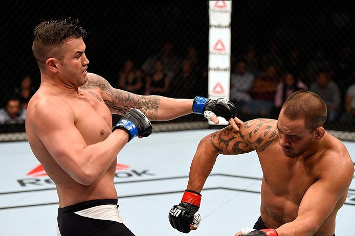 BRISBANE, AUSTRALIA - MARCH 20:  (L-R) Steve Bosse of Canada reacts after punching James Te Huna of New Zealand in their light heavyweight bout during the UFC Fight Night event at the Brisbane Entertainment Centre on March 20, 2016 in Brisbane, Australia.