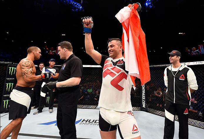 BRISBANE, AUSTRALIA - MARCH 20:  (R-L) Steve Bosse of Canada celebrates after defeating James Te Huna of New Zealand by KO in their light heavyweight bout during the UFC Fight Night event at the Brisbane Entertainment Centre on March 20, 2016 in Brisbane,