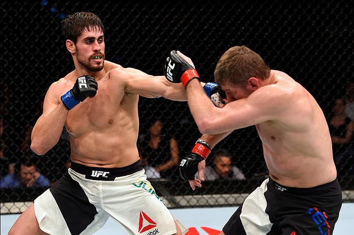 BRISBANE, AUSTRALIA - MARCH 20:  (L-R) Antonio Carlos Junior of Brazil punches Daniel Kelly of Australia in their middleweight bout during the UFC Fight Night event at the Brisbane Entertainment Centre on March 20, 2016 in Brisbane, Australia. (Photo by J