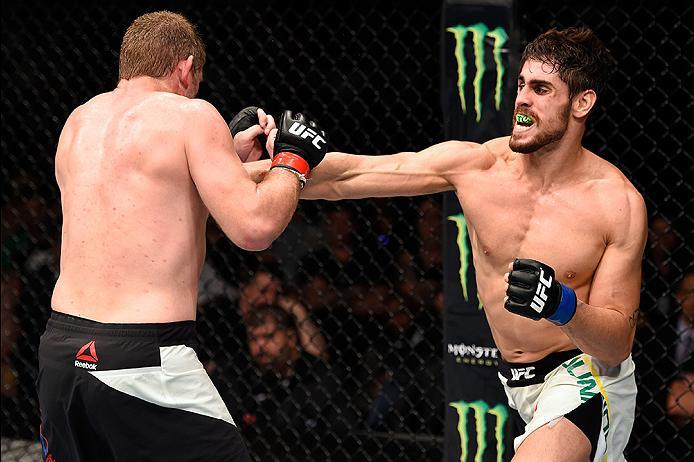 BRISBANE, AUSTRALIA - MARCH 20: (R-L) Antonio Carlos Junior of Brazil kicks Daniel Kelly of Australia in their middleweight bout during the UFC Fight Night event at the Brisbane Entertainment Centre on March 20, 2016 in Brisbane, Australia. (Photo by Jos