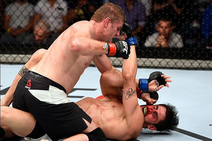BRISBANE, AUSTRALIA - MARCH 20: (L-R) Daniel Kelly of Australia punches Antonio Carlos Junior of Brazil in their middleweight bout during the UFC Fight Night event at the Brisbane Entertainment Centre on March 20, 2016 in Brisbane, Australia. (Photo by J