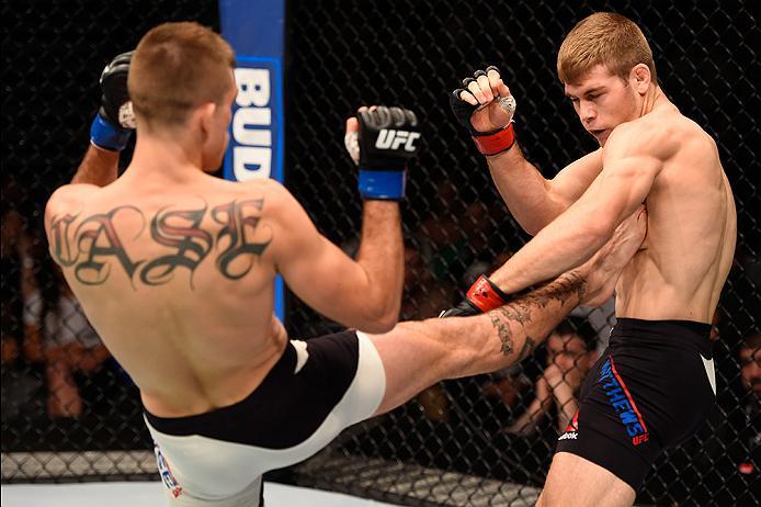 BRISBANE, AUSTRALIA - MARCH 20:  (L-R) Johnny Case kicks Jake Matthews of Australia in their lightweight bout during the UFC Fight Night event at the Brisbane Entertainment Centre on March 20, 2016 in Brisbane, Australia. (Photo by Josh Hedges/Zuffa LLC/Z