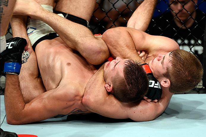 BRISBANE, AUSTRALIA - MARCH 20:  (R-L) Jake Matthews of Australia submits Johnny Case of the United States in their lightweight bout during the UFC Fight Night event at the Brisbane Entertainment Centre on March 20, 2016 in Brisbane, Australia. (Photo by 