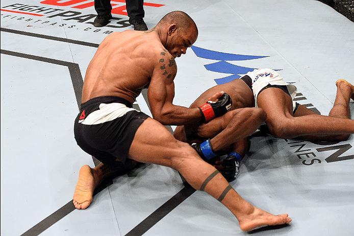 BRISBANE, AUSTRALIA - MARCH 20: (L-R) Hector Lombard of Cuba punches Neil Magny of the United States in their welterweight bout during the UFC Fight Night event at the Brisbane Entertainment Centre on March 20, 2016 in Brisbane, Australia. (Photo by Josh