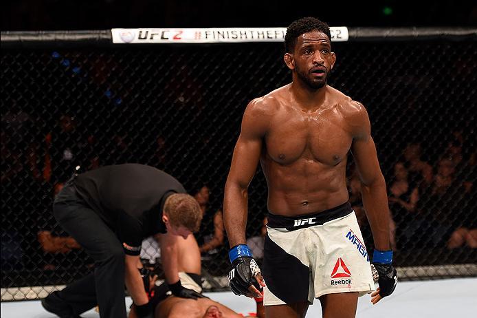 BRISBANE, AUSTRALIA - MARCH 20:  (R-L) Neil Magny of the United States walks to his corner after defeating Hector Lombard of Cuba in their welterweight bout during the UFC Fight Night event at the Brisbane Entertainment Centre on March 20, 2016 in Brisban