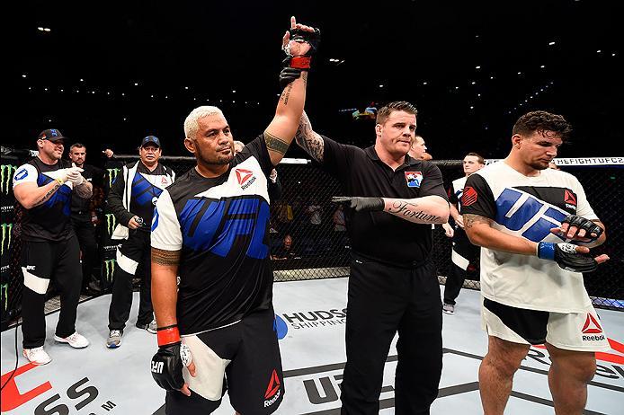 BRISBANE, AUSTRALIA - MARCH 20: (L-R) Mark Hunt of New Zealand celebrates after defeating Frank Mir of the United States after their heavyweight bout during the UFC Fight Night event at the Brisbane Entertainment Centre on March 20, 2016 in Brisbane, Aus