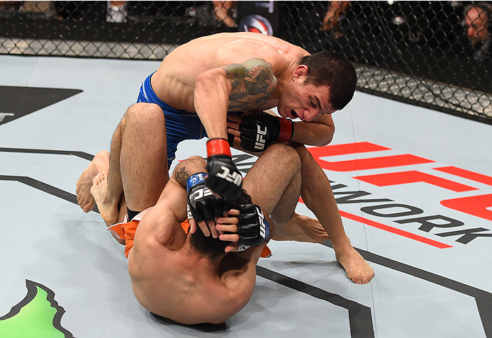 MONTERREY, MEXICO - NOVEMBER 21: Cesar Arzamendia (top) of Paraguay punches Polo Reyes of Mexico in their lightweight bout during the UFC Fight Night event at Arena Monterrey on November 21, 2015 in Monterrey, Mexico. (Photo by Jeff Bottari/Zuffa LLC/Zu