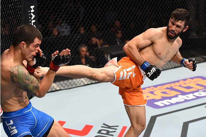 MONTERREY, MEXICO - NOVEMBER 21: (R-L) Polo Reyes of Mexico kicks Cesar Arzamendia of Paraguay in their lightweight bout during the UFC Fight Night event at Arena Monterrey on November 21, 2015 in Monterrey, Mexico. (Photo by Jeff Bottari/Zuffa LLC/Zuff