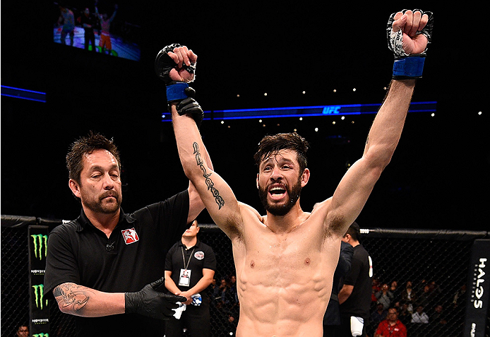 MONTERREY, MEXICO - NOVEMBER 21: Polo Reyes of Mexico celebrates after his knockout victory over Cesar Arzamendia of Paraguay in their lightweight bout during the UFC Fight Night event at Arena Monterrey on November 21, 2015 in Monterrey, Mexico. (Photo