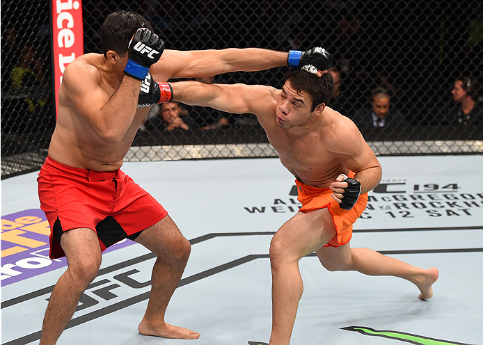 MONTERREY, MEXICO - NOVEMBER 21: (R-L) Vernon Ramos of Panama and Alvaro Herrera of Mexico trade punches in their welterweight bout during the UFC Fight Night event at Arena Monterrey on November 21, 2015 in Monterrey, Mexico. (Photo by Jeff Bottari/Zuf