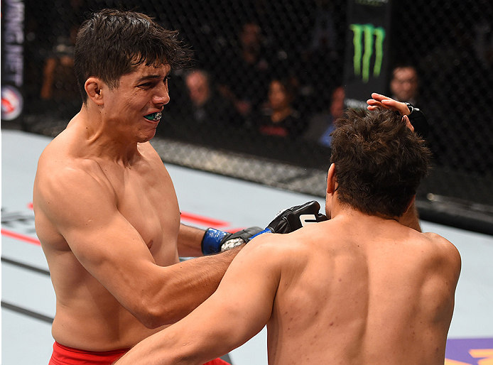 MONTERREY, MEXICO - NOVEMBER 21: (L-R) Alvaro Herrera of Mexico knocks out Vernon Ramos of Panama in their welterweight bout during the UFC Fight Night event at Arena Monterrey on November 21, 2015 in Monterrey, Mexico. (Photo by Jeff Bottari/Zuffa LLC/