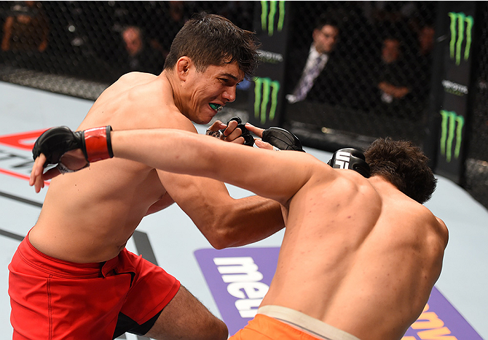 MONTERREY, MEXICO - NOVEMBER 21: (L-R) Alvaro Herrera of Mexico knocks out Vernon Ramos of Panama in their welterweight bout during the UFC Fight Night event at Arena Monterrey on November 21, 2015 in Monterrey, Mexico. (Photo by Jeff Bottari/Zuffa LLC/