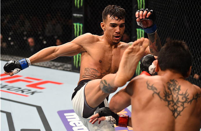 MONTERREY, MEXICO - NOVEMBER 21: (L-R) Andre Fili of the United States kicks Gabriel Benitez of Mexico in their featherweight bout during the UFC Fight Night event at Arena Monterrey on November 21, 2015 in Monterrey, Mexico. (Photo by Jeff Bottari/Zuff