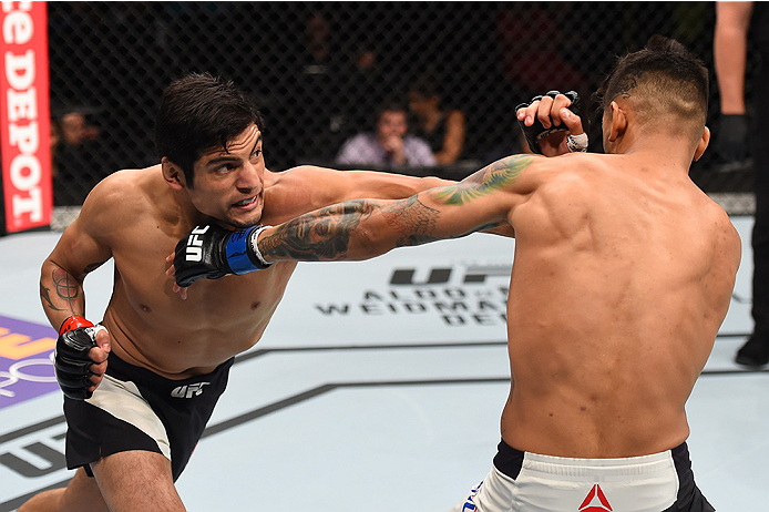 MONTERREY, MEXICO - NOVEMBER 21:  (L-R) Gabriel Benitez of Mexico punches Andre Fili of the United States in their featherweight bout during the UFC Fight Night event at Arena Monterrey on November 21, 2015 in Monterrey, Mexico.  (Photo by Jeff Bottari/Zu