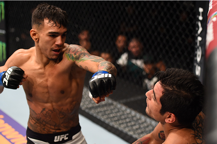 MONTERREY, MEXICO - NOVEMBER 21:  (L-R) Andre Fili of the United States punches Gabriel Benitez of Mexico in their featherweight bout during the UFC Fight Night event at Arena Monterrey on November 21, 2015 in Monterrey, Mexico.  (Photo by Jeff Bottari/Zu